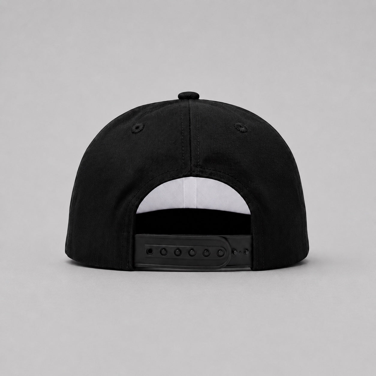 Rear view of the Capstify Skull Voltage black A-Frame baseball cap featuring an adjustable black snapback closure, embroidered ventilation eyelets, and a structured cotton crown.