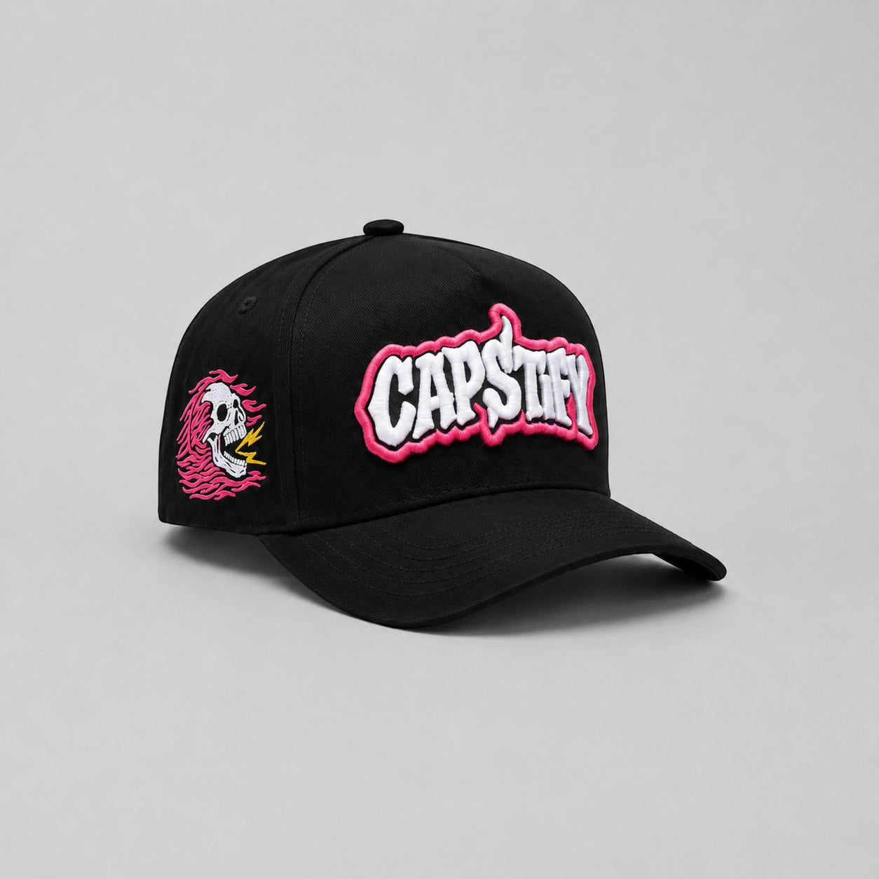 Black Capstify Skull Voltage A-Frame cap with pink 3D puff embroidery and flaming skull side patch.