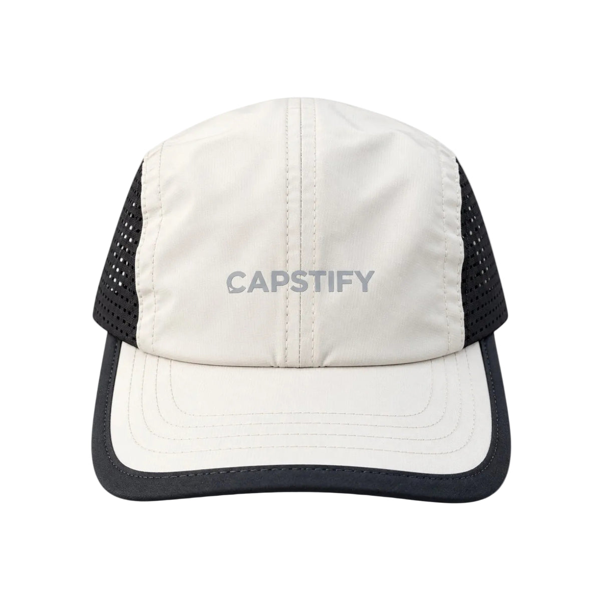 A CAPSTIFY brand trucker-style cap featuring an off-white front panel and visor with black mesh side panels and a black brim trim, shown against a plain white background.